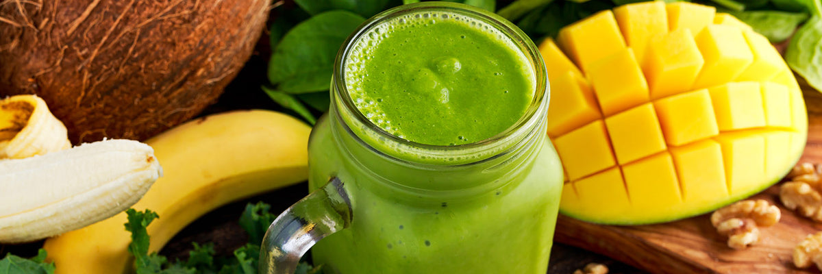 Healthy Green Reach Vitamins Smoothie with baby leaf spinach, kale, mango, banana, lime, walnut and coconut water.