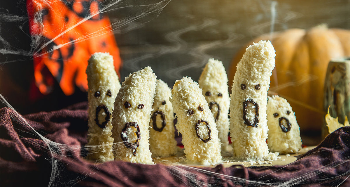 Homemade halloween scary banana ghosts monsters with chocolate faces.