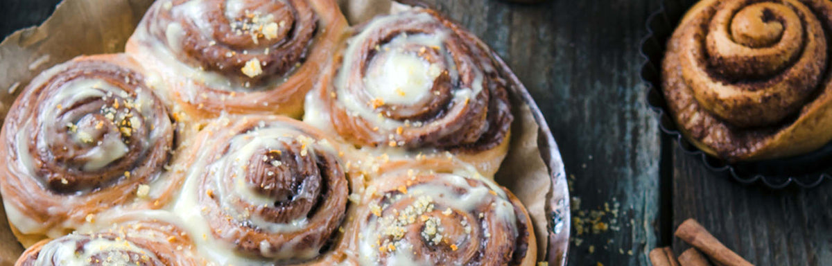 Fresh Sweet Homemade Cinnamon Rolls on the black background